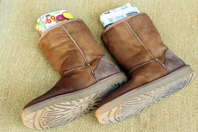 Stuff your Ugg boots with paper to preserve the shape of your boots when cleaning